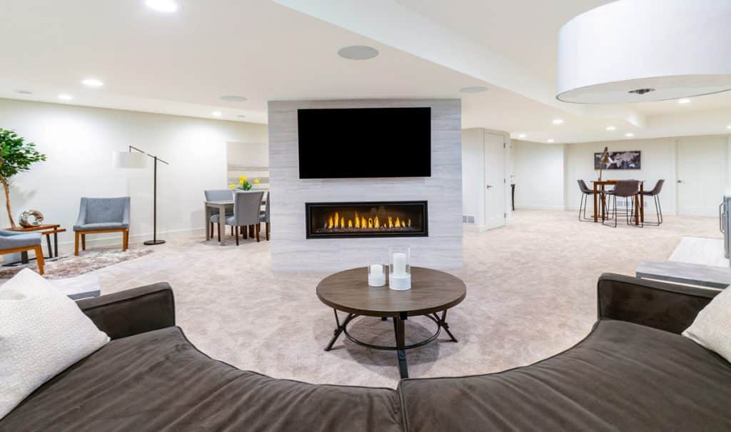 Luxury basement remodel with fireplace