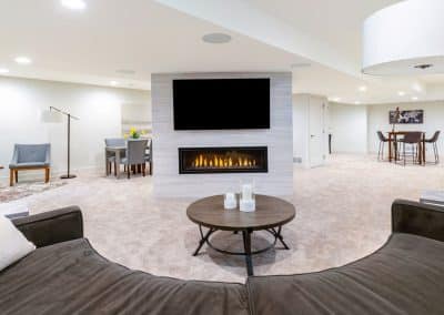 Luxury basement remodel with fireplace