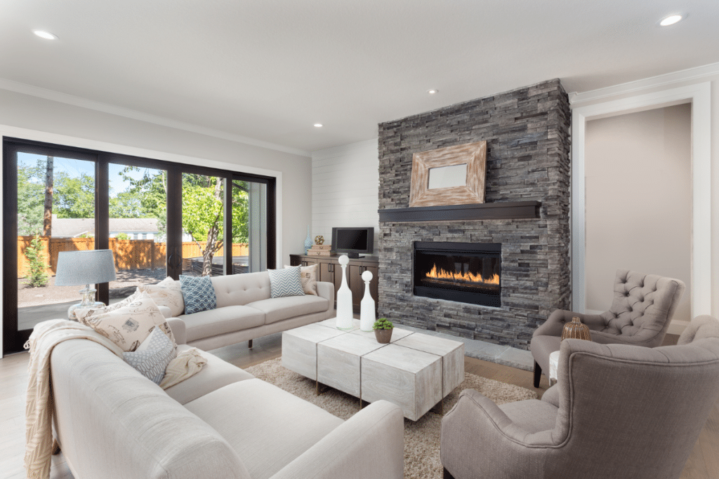 Overcoming your home remodeling fears with an updated living room with stack stone fireplace.